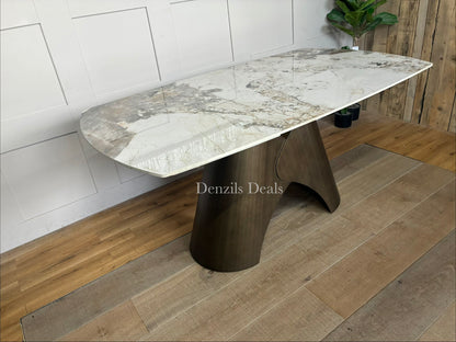 Contemporary oval extending dining table featuring a Pandora marble-style ceramic top and a sculptural matte bronze metal pedestal base
