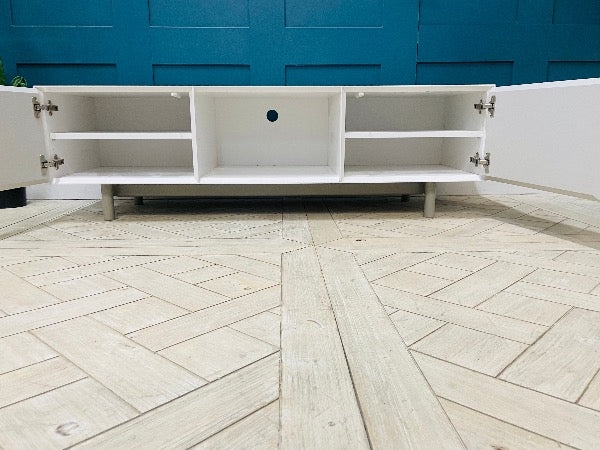 Content by Terence Conran Stanford TV stand with geometric diagonal grooves, a central shelf, and oak legs