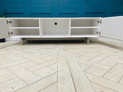 Content by Terence Conran Stanford TV stand with geometric diagonal grooves, a central shelf, and oak legs