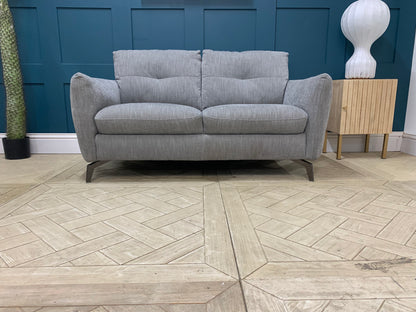 Detail of grey mix cross weave fabric upholstery on the Sofology Mimi 2 seater sofa.