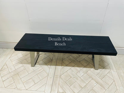 Newington Black Dining Table (180cm) & Bench, Small By Gallary Direct
Solid black acacia wood top
Angular metal legs
Seat 4 - 6 people
