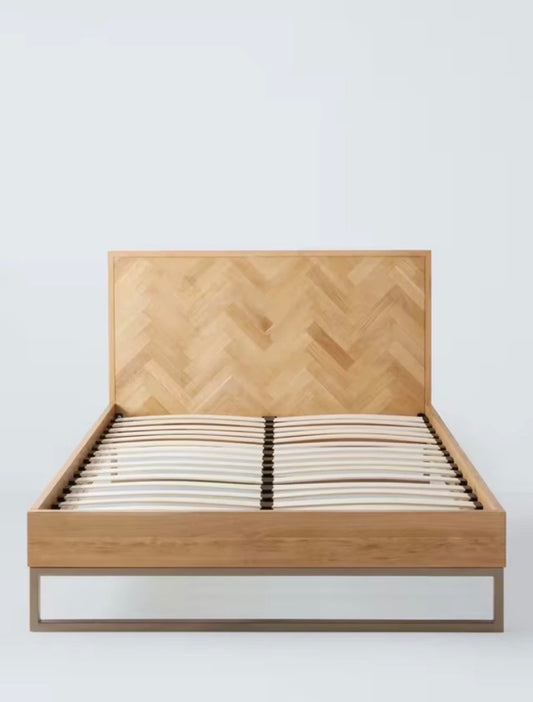 Double John Lewis Estate bed frame in natural oak with parquet patterned headboard and lacquered finish, supported by a sprung slat base."