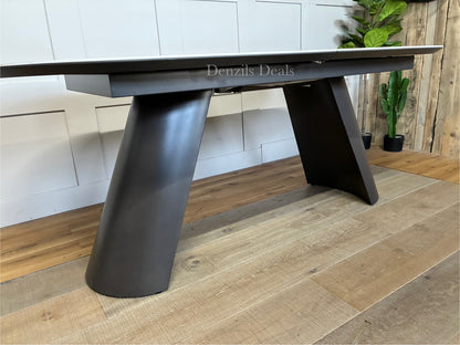 Dwell Lorea extending dining table with a white marble-effect ceramic top and grey sloping legs