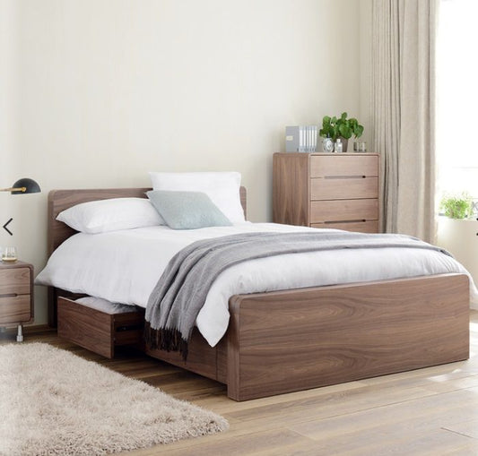 Dwell Notch storage bed in warm walnut veneer with four built-in pull-out drawers and a clean, low-profile minimalist frame.