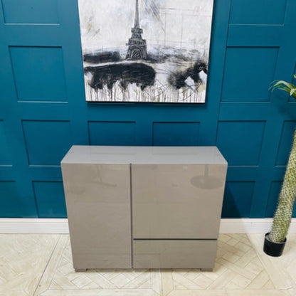 Dwell Olmo sideboard in stone colour high gloss finish with two doors and a large drawer. Front view