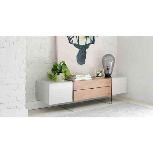 Dwell Sturado media unit featuring a grey and warm wood finish, set upon transparent glass legs that create a sleek, floating effect