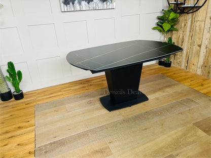 The Dwell Tabula Black Ceramic Marble Effect Extending Dining Table measures 150cm extending to 220cm, featuring a durable, heat- and stain-resistant black ceramic surface with a marble effect.