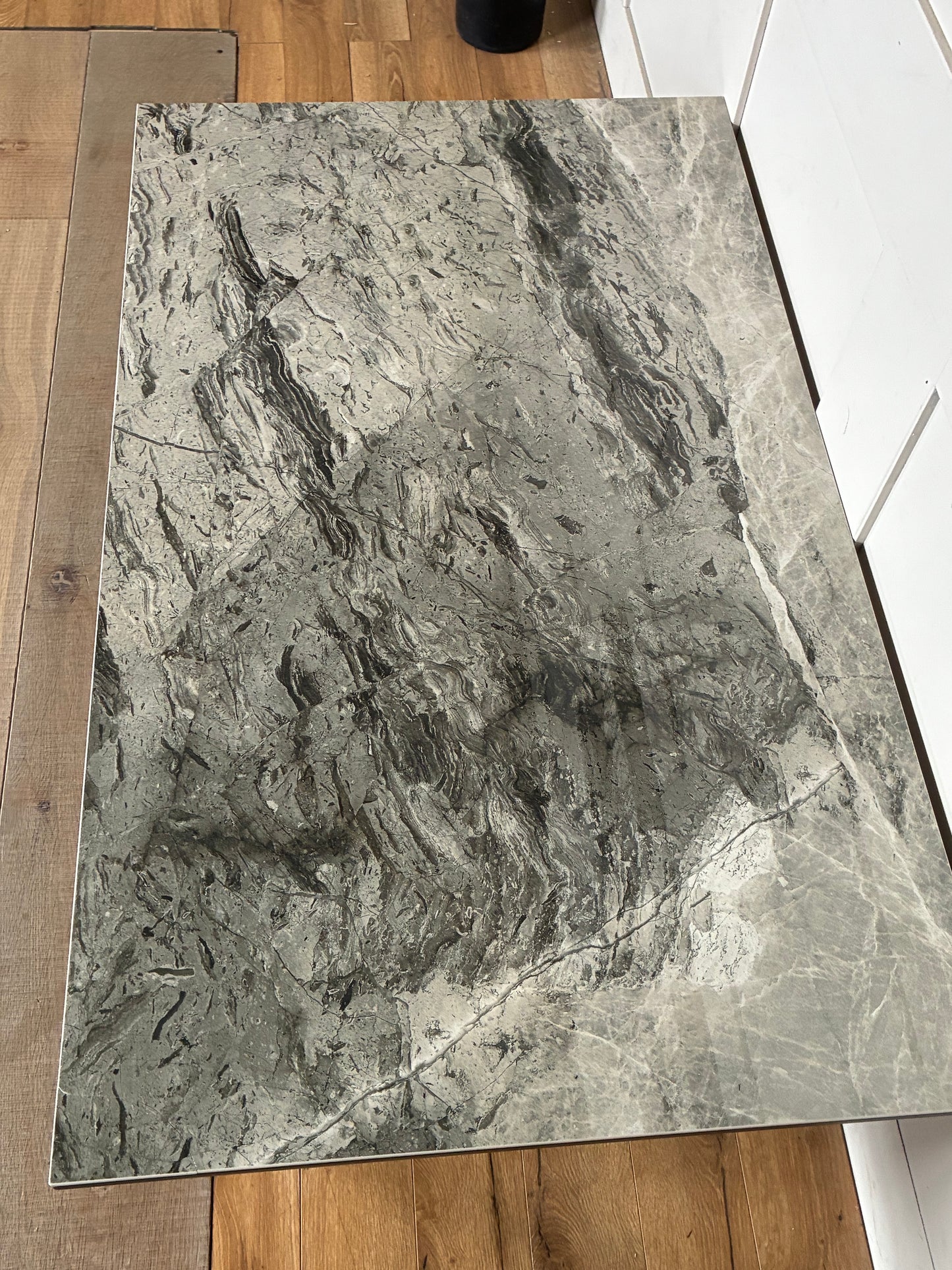 Dwell Teno grey ceramic top coffee table with architectural metal legs.