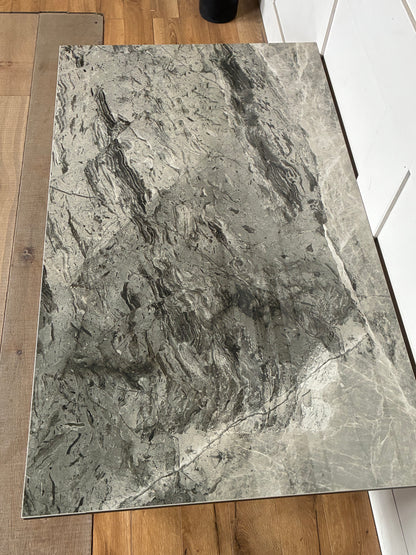Dwell Teno grey ceramic top coffee table with architectural metal legs.