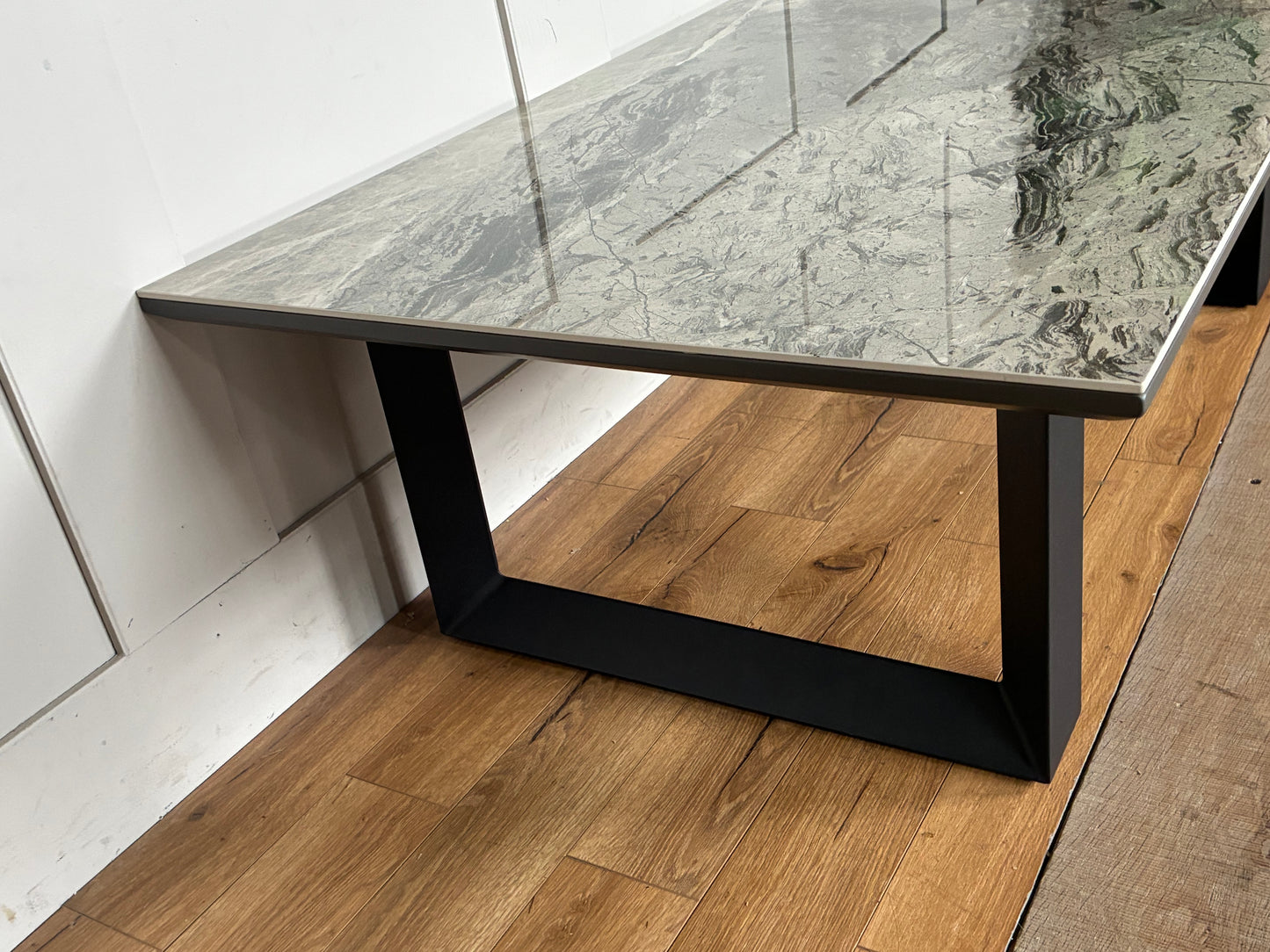 Dwell Teno grey ceramic top coffee table with architectural metal legs.