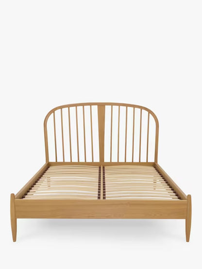 Ercol for John Lewis Hambledon double bed frame, crafted from solid oak with a warm grain, featuring a tall curved, spoked headboard and pre-sprung wooden slatted base