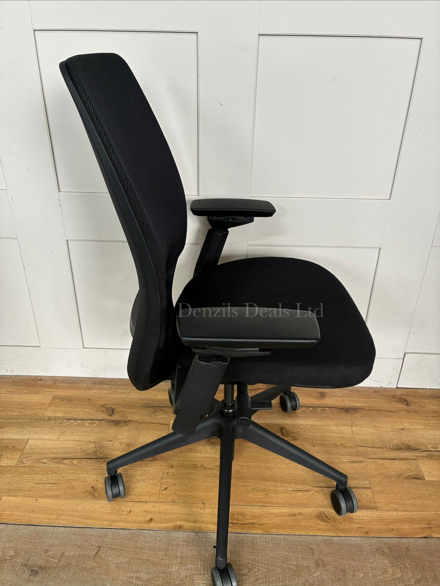 Ergonomic Steelcase Series 2 office chair with a breathable mesh back, visible LiveBack lumbar support, 4D adjustable armrests, and a five-star caster base.