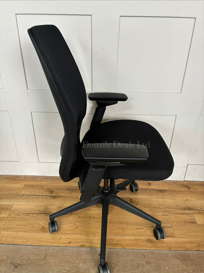 Ergonomic Steelcase Series 2 office chair with a breathable mesh back, visible LiveBack lumbar support, 4D adjustable armrests, and a five-star caster base.