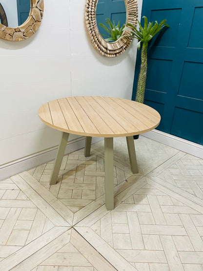 Eton round dining table in Prairie finish, featuring a light oak wood top and grey pedestal base by Gallery Direct.