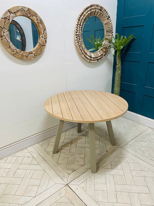 Eton round dining table in Prairie finish, featuring a light oak wood top and grey pedestal base by Gallery Direct.