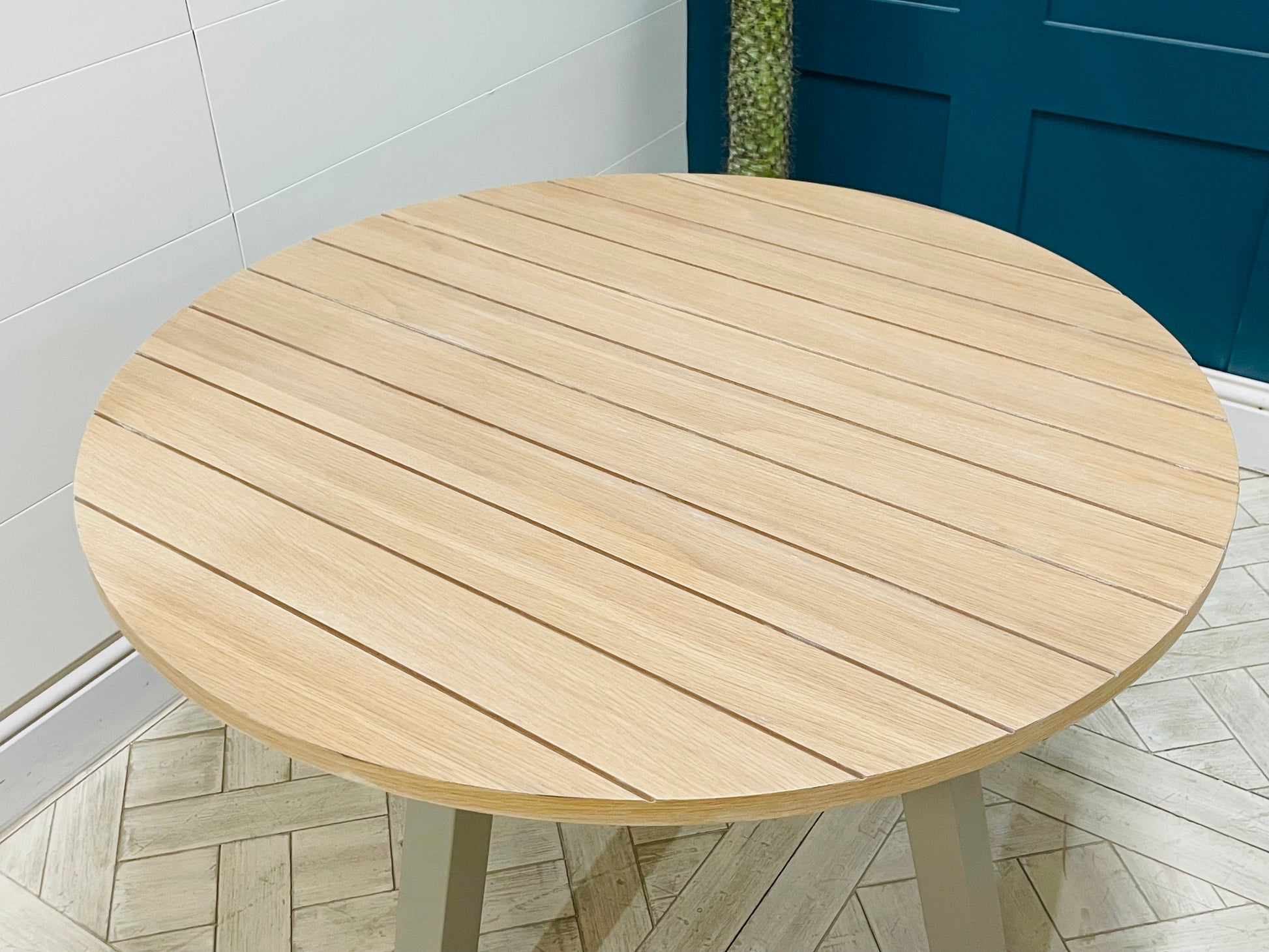 Gallery Direct Eton round dining table, light oak and grey Prairie finish.