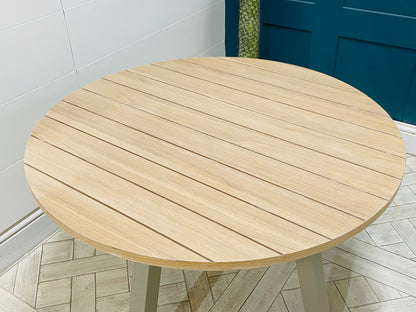 Gallery Direct Eton round dining table, light oak and grey Prairie finish.