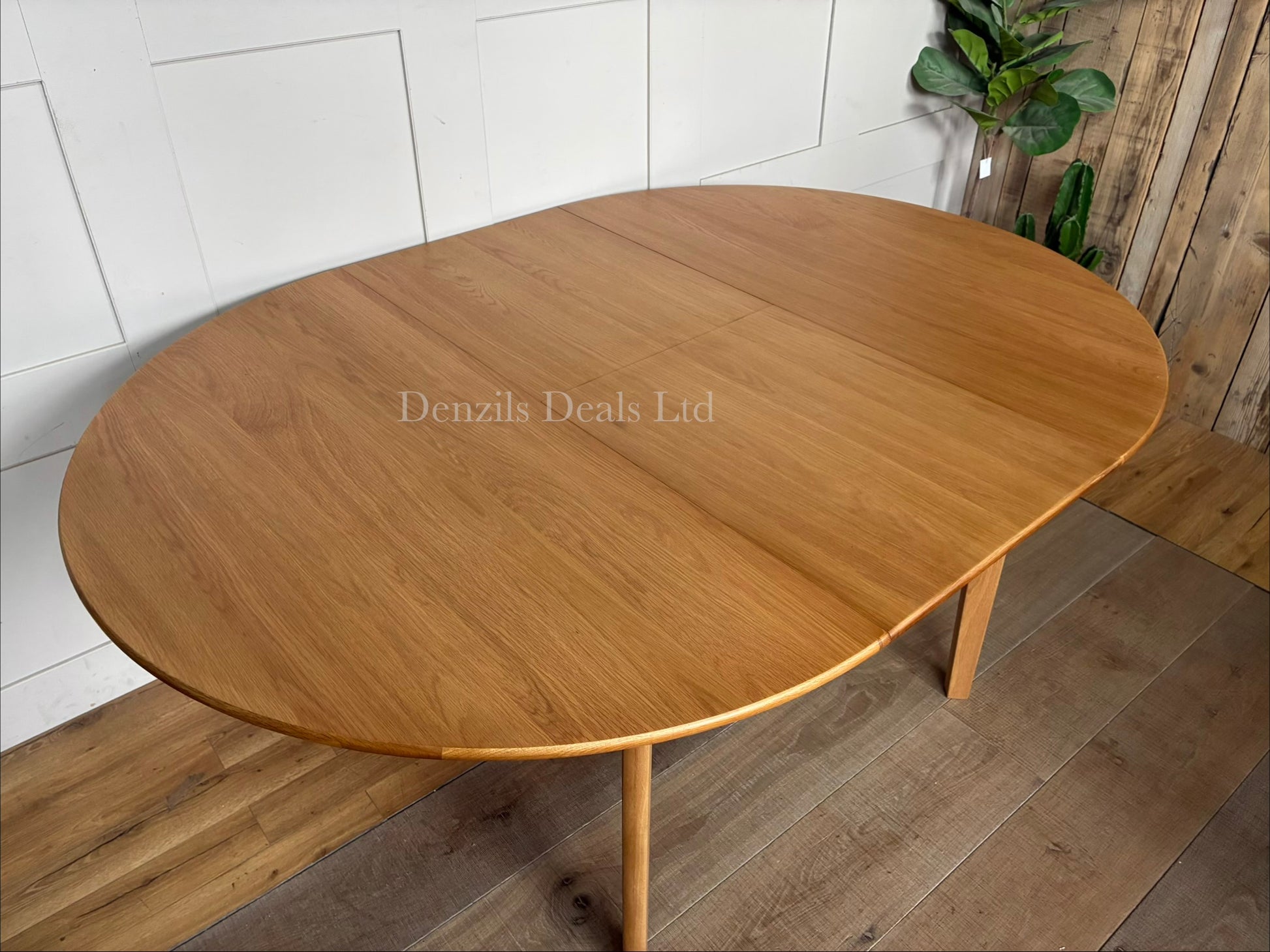 Fishe and Lilly Wright round extendable dining table made from solid light oak wood