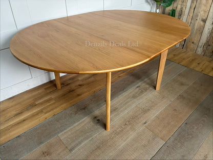 Fishe and Lilly Wright round extendable dining table made from solid light oak wood