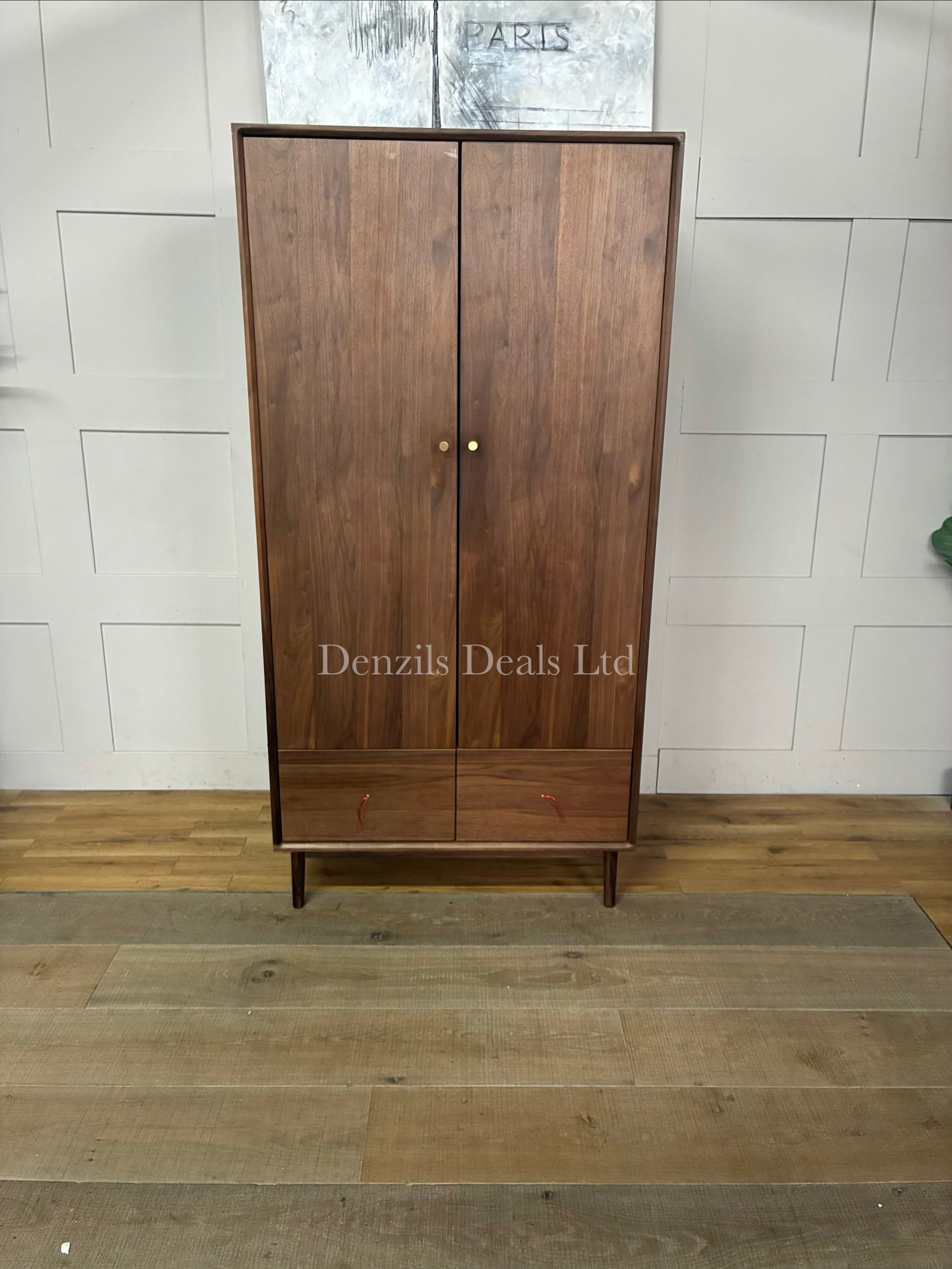 Fishe and Lilly Wright two-door mid-century modern wardrobe in a rich dark walnut finish, featuring a wide base drawer and sleek tapered legs.