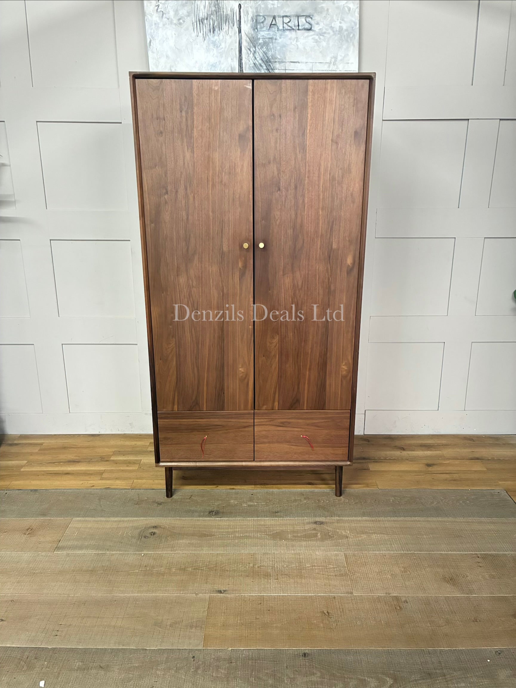 Fishe and Lilly Wright two-door mid-century modern wardrobe in a rich dark walnut finish, featuring a wide base drawer and sleek tapered legs.