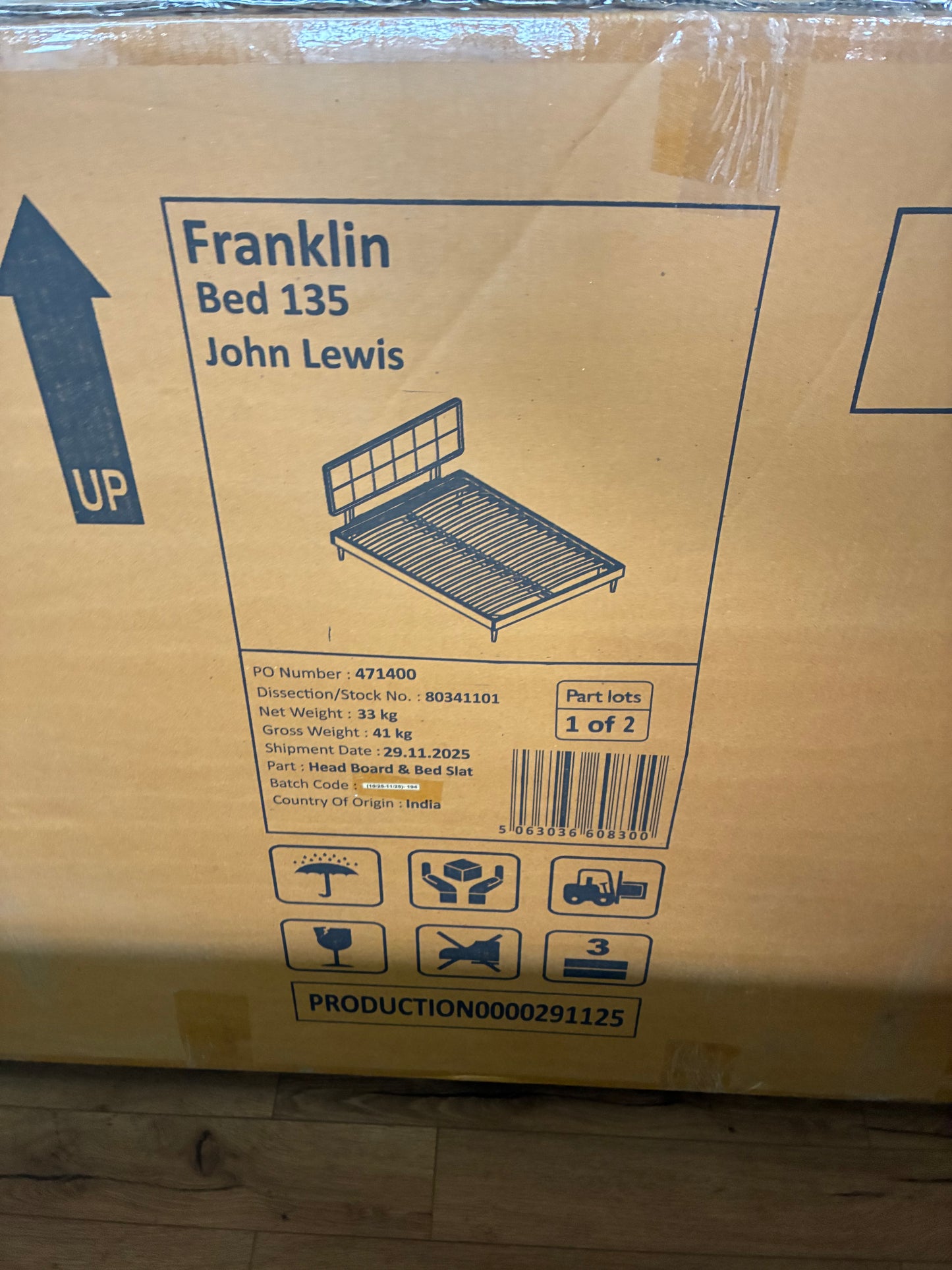 Dark brown wooden double bed frame by Swoon for John Lewis, featuring an acacia wood geometric chevron headboard and low-profile mid-century legs