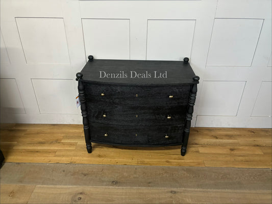 Front-facing view of an upright acacia wood chest of drawers featuring three clean-front storage drawers and a distinctive vertical spindle framework along the structure and legs.