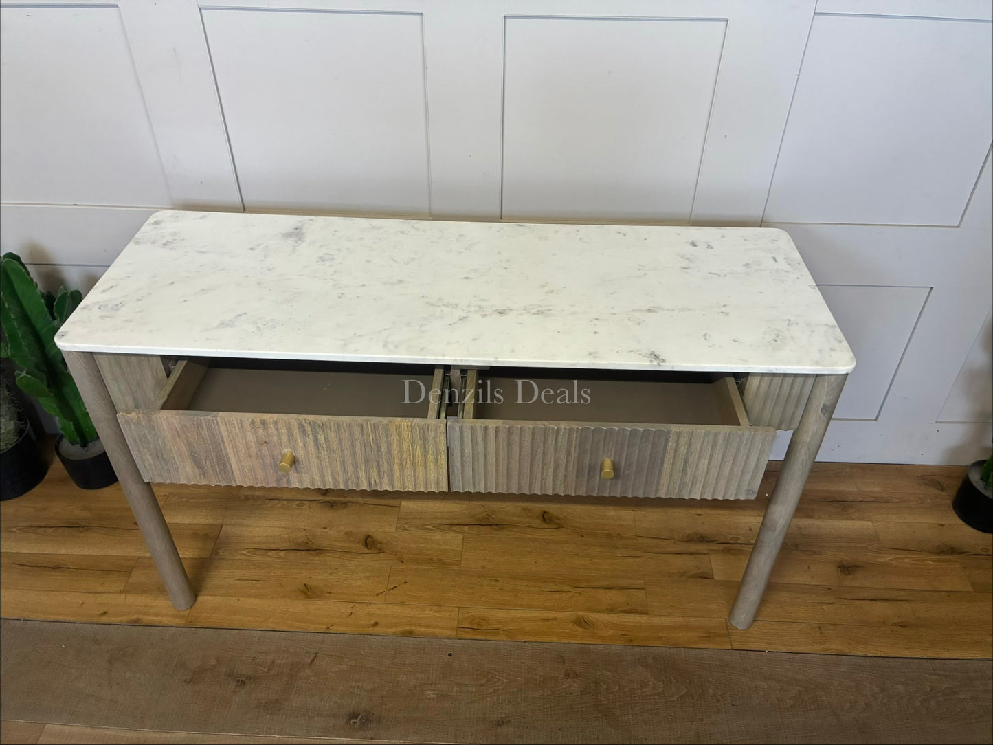 Marmo Marble Top 2 Drawer Console Table with a polished white Indian Carrera marble surface with unique grey and blue veining, Crafted from solid mango wood with a grey-wash finish, two drawers feature striking vertical ribbed textures that provide architectural depth. Finished with elegant round button knobs, typically in brass or gold-toned metal