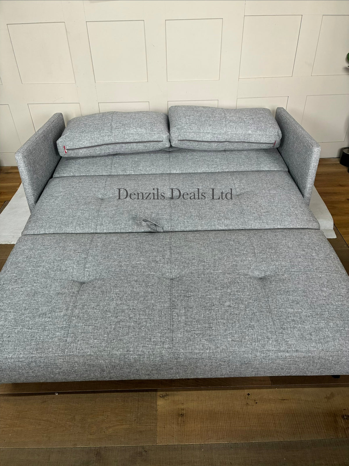 Front view of the Innovation Living Cubed 160 Sofa Bed in Twist Granite. The compact, armless three-seater sofa features a dark grey, textured weave fabric with two large matching back cushions and stands on low, slim black matte metal legs.