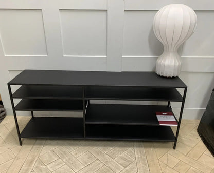 Front view of the Made.com Munro TV stand, showing its slim metallic frame in a warm brass finish with multiple levels of open shelving, ideal for a contemporary or industrial living room setup