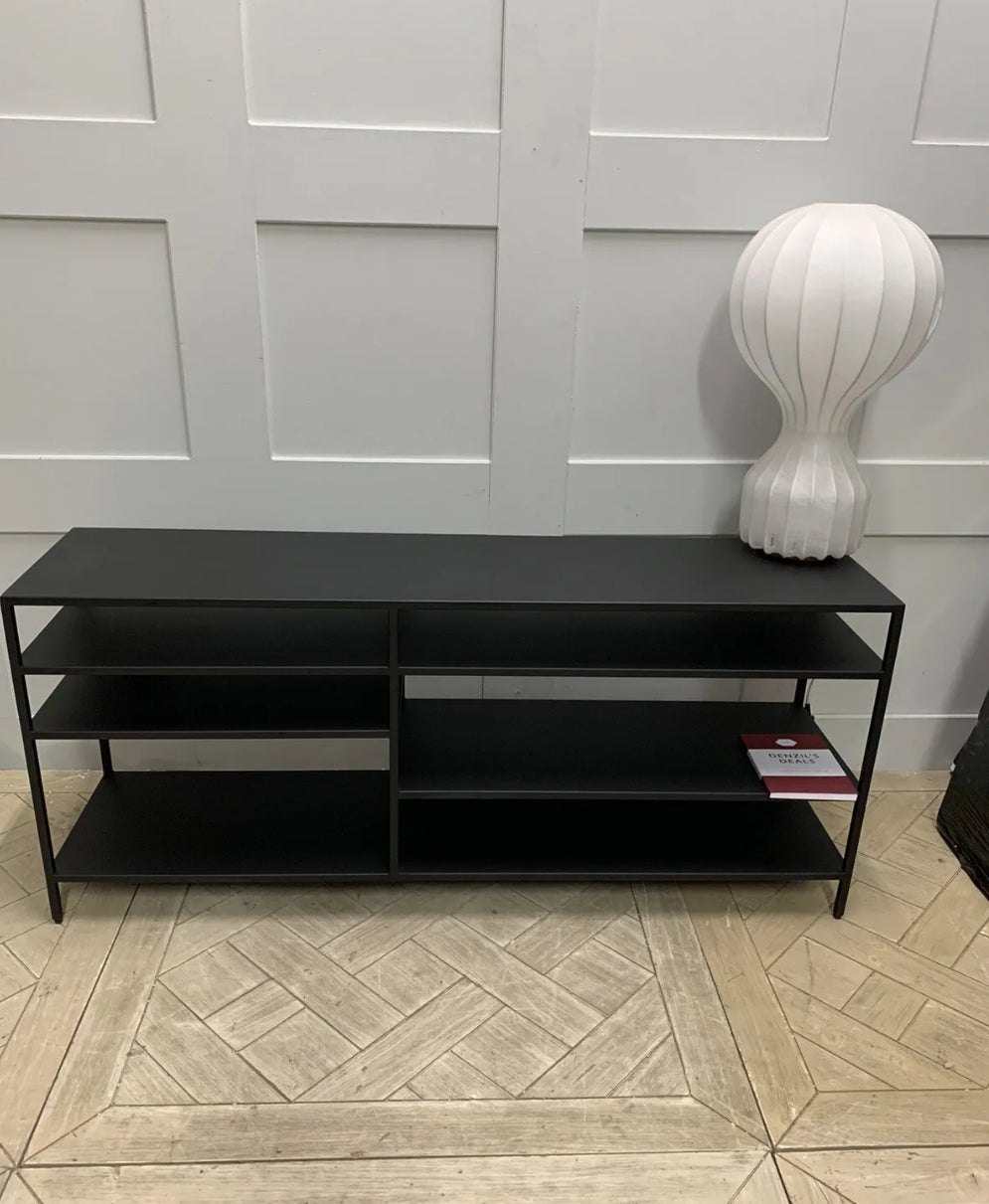 Front view of the Made.com Munro TV stand, showing its slim metallic frame in a warm brass finish with multiple levels of open shelving, ideal for a contemporary or industrial living room setup
