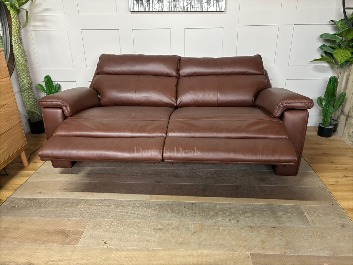 Front view of the Selby 3-seater electric recliner sofa from Oak Furnitureland, upholstered in premium Virgo Chestnut brown leather. The sofa features thick cushioned armrests, plush pocket-sprung seats, and a sleek, transitional design that blends classic and contemporary styles.