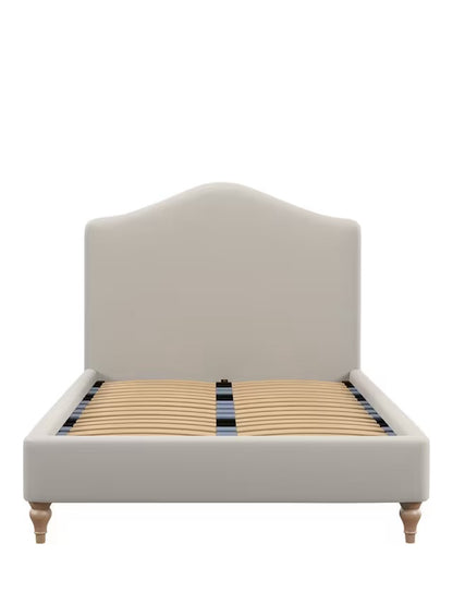 Front view of the king-size John Lewis Alice Bed Frame, showcasing a beige fabric headboard with a gentle curve, vertical seaming, and light-colored wooden legs