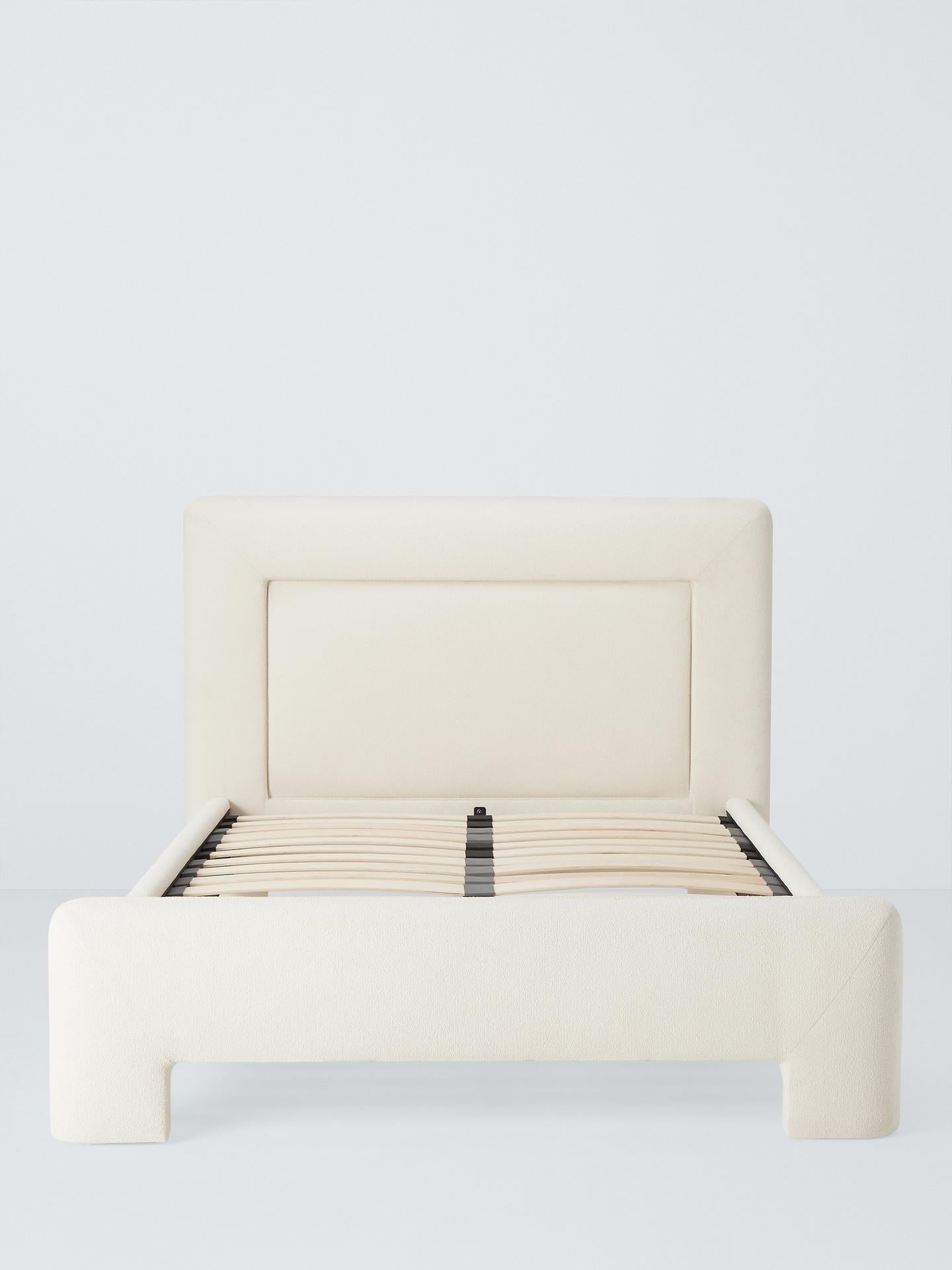 Full view of the John Lewis Blocky super king bed frame in a contemporary bedroom setting, featuring a sculpted, blocky design and cosy white bouclé upholstery