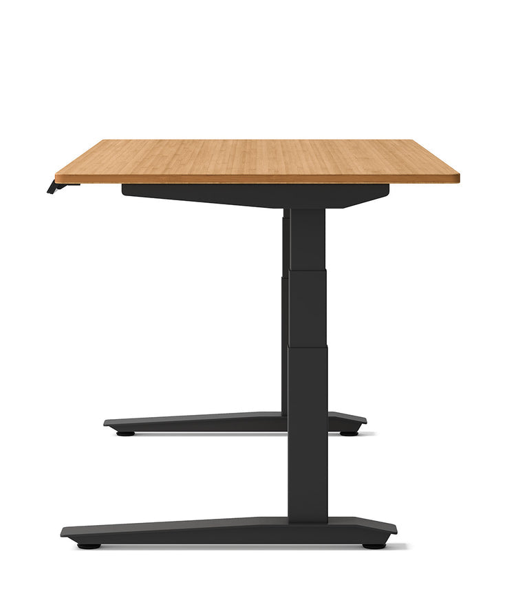 Fully Jarvis sit-stand desk by Herman Miller with a natural wood top and black frame.