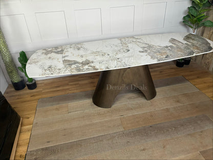 Gallery Direct Bresso Bronze Extending Dining Table with a marble-effect ceramic top and a matte bronze metal base, shown in its closed position to accommodate 6 seats.