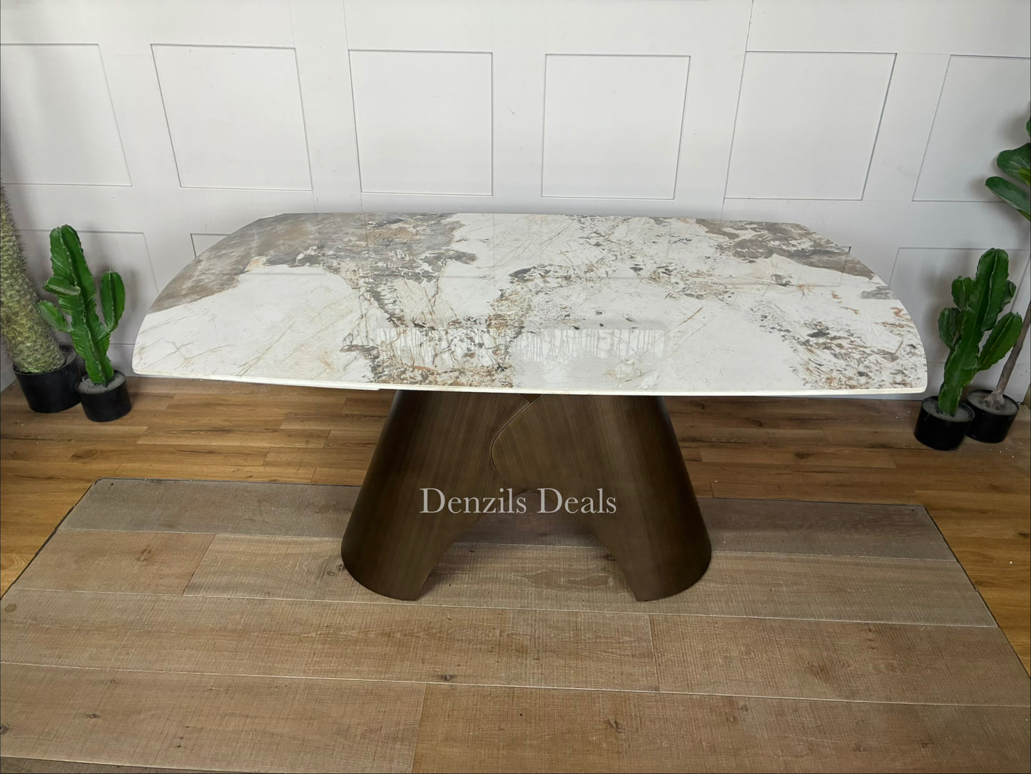 Gallery Direct Bresso extending dining table featuring a white Carrara marble-style ceramic top and a modern matt bronze metal base."