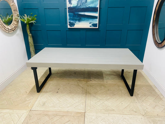 Gallery Direct Frame 8-seater rectangular outdoor dining table in cement grey, featuring a modern minimalistic aesthetic with a smooth tabletop and robust, weather-resistant finish, perfect for contemporary garden spaces."
