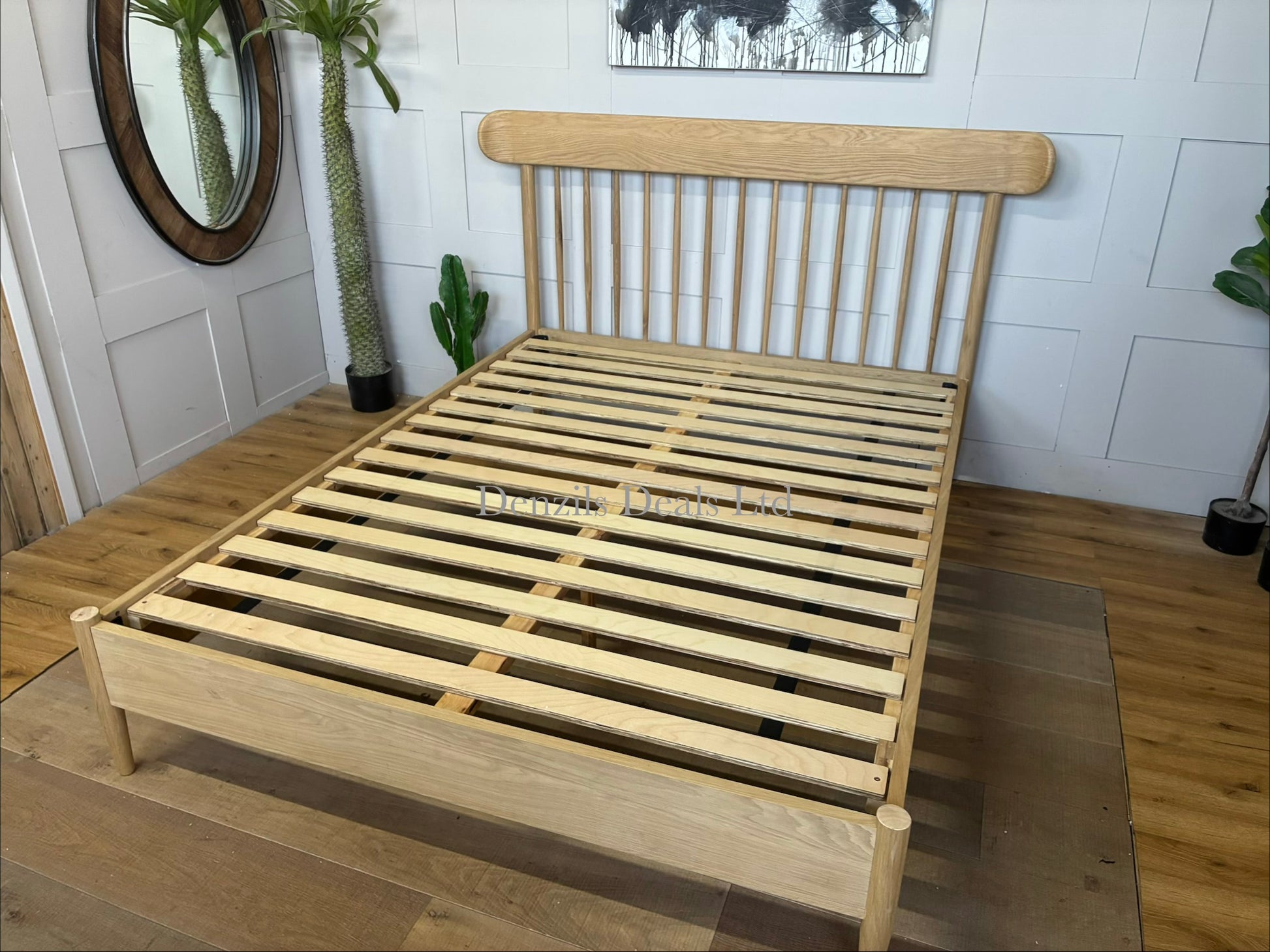 Gallery Direct Hatfield 5ft king size bed frame crafted from solid oak and oak veneers featuring an airy vertical spindle design in a warm natural wood finish