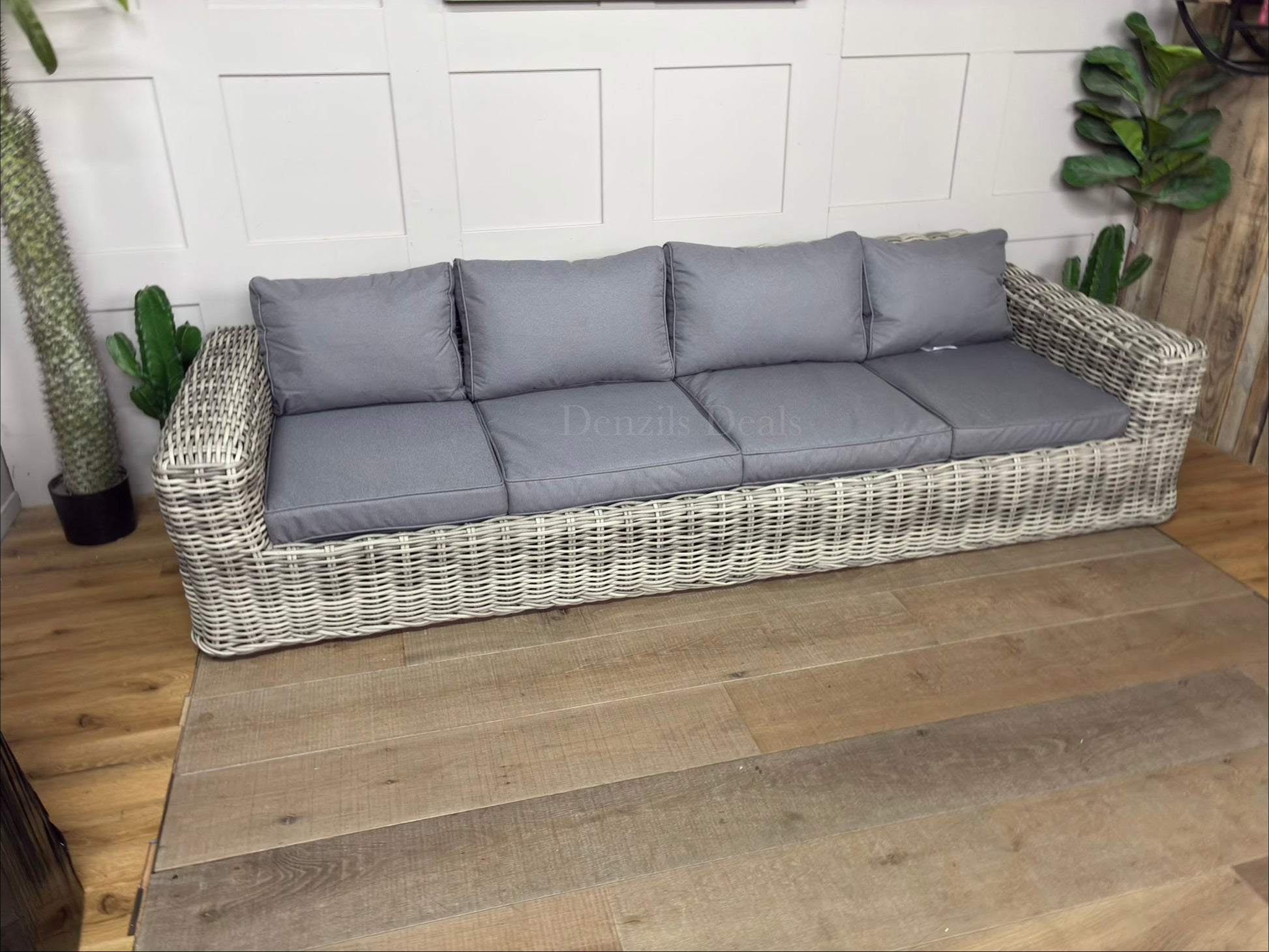 Three-seater garden sofa from the Gallery Direct Ragusa collection, featuring a modern woven rattan frame and deep, padded cushions."