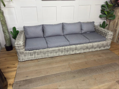 Three-seater garden sofa from the Gallery Direct Ragusa collection, featuring a modern woven rattan frame and deep, padded cushions."