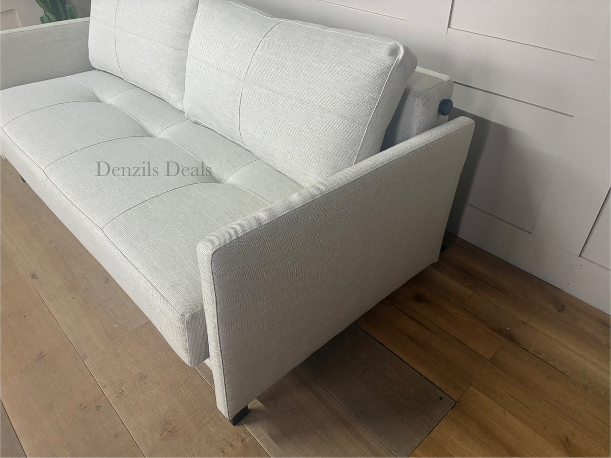 Innovation Living Cubed 160 modern sofa bed in Mixed Dance Natural fabric with wooden legs.