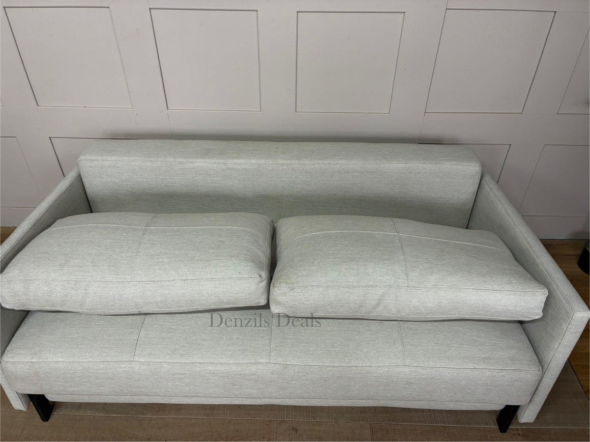 Innovation Living Cubed 160 modern sofa bed in Mixed Dance Natural fabric with wooden legs. Showing pillows 