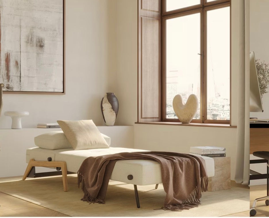 Innovation Living Cubed 90 convertible armchair in a light beige, textured Mixed Dance Natural fabric with light wood legs.