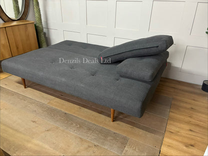 Innovation Living Recast sofa bed featuring a button-tufted fabric design, loose back cushions, and tapered dark wood legs.