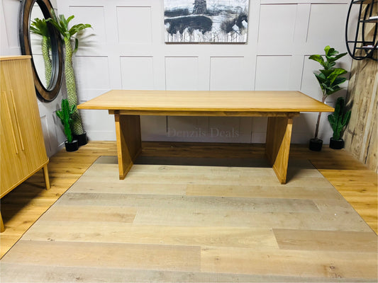 John Lewis Anders 8-seater rectangular dining table in natural solid oak with a Scandi-style design, featuring distinctive groove details on the legs and a 220cm long tabletop with visible grain