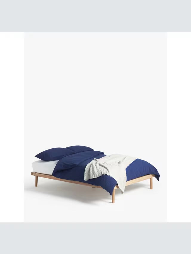 John Lewis Bow double platform bed frame in natural oak, showing the minimalist, low-profile wooden structure and sprung slatted base."