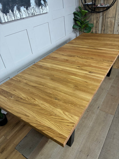 John Lewis Calia solid oak extending dining table with industrial iron base."