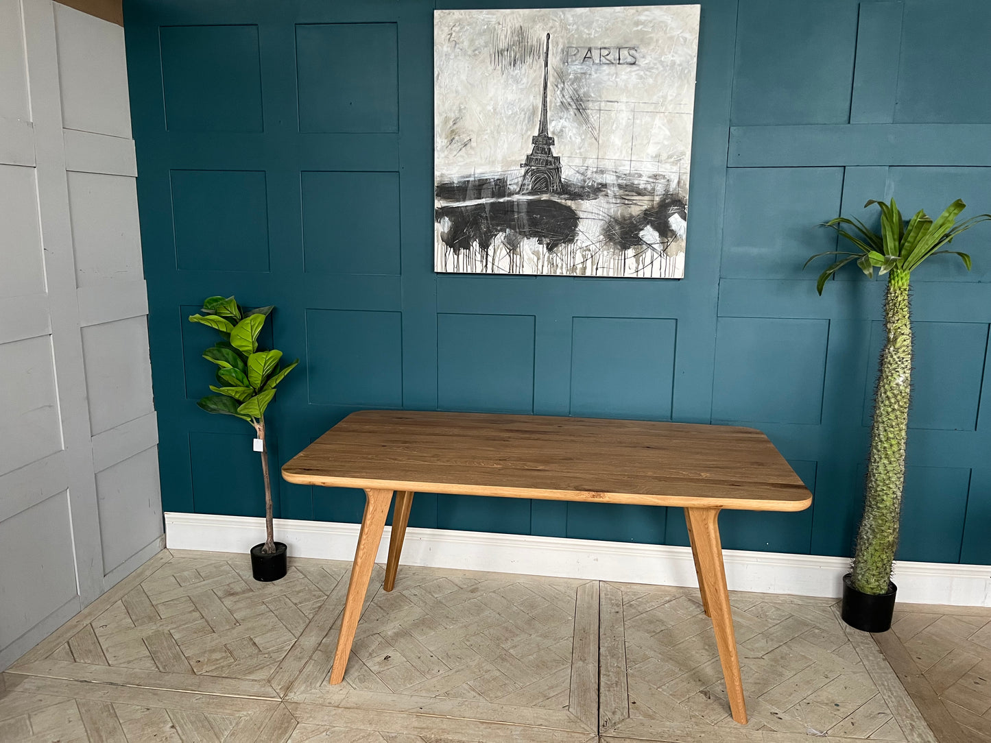 John Lewis Cara 4-seater dining table in natural American oak with slender legs and a slim-line top