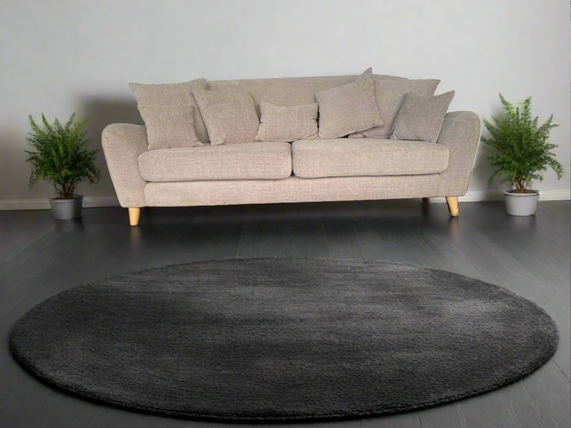 Front-facing view of the John Lewis Laze 3-seater sofa in a textured Opal Putty fabric, featuring deep-set cushions, pillowy armrests, and angled wooden-finish legs